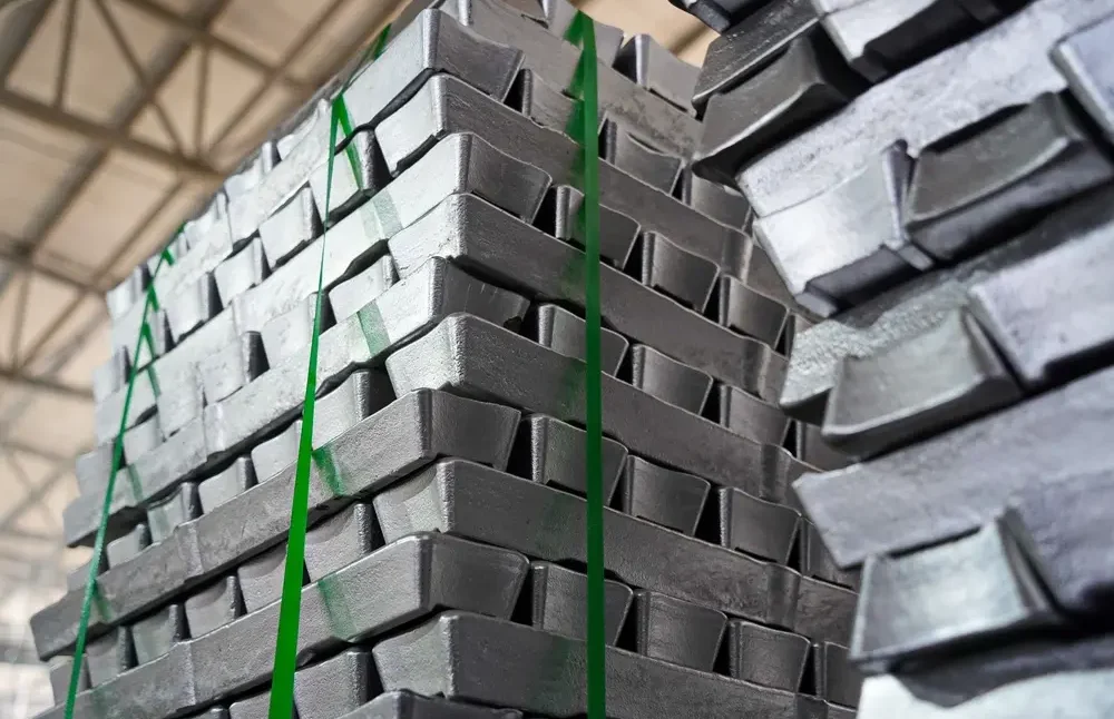 Stacks of aluminum ingots in a warehouse