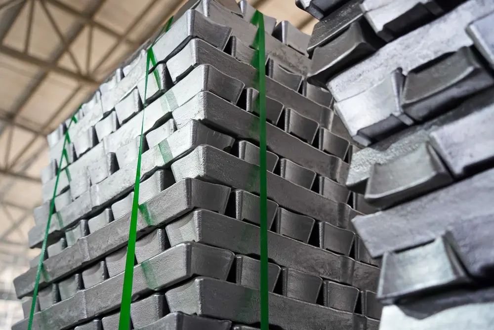 Stacks of aluminum ingots in a warehouse