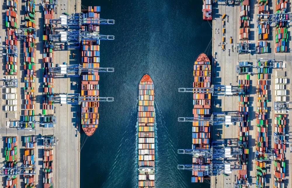 Aerial view of container cargo ships at a pier