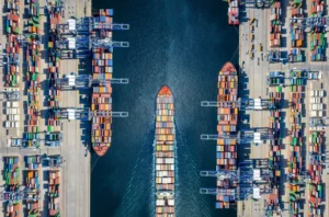 Aerial view of container cargo ships at a pier