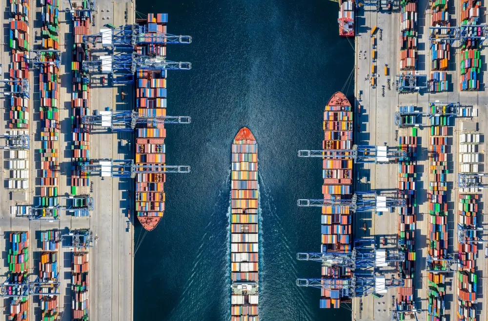 Aerial view of container cargo ships at a pier
